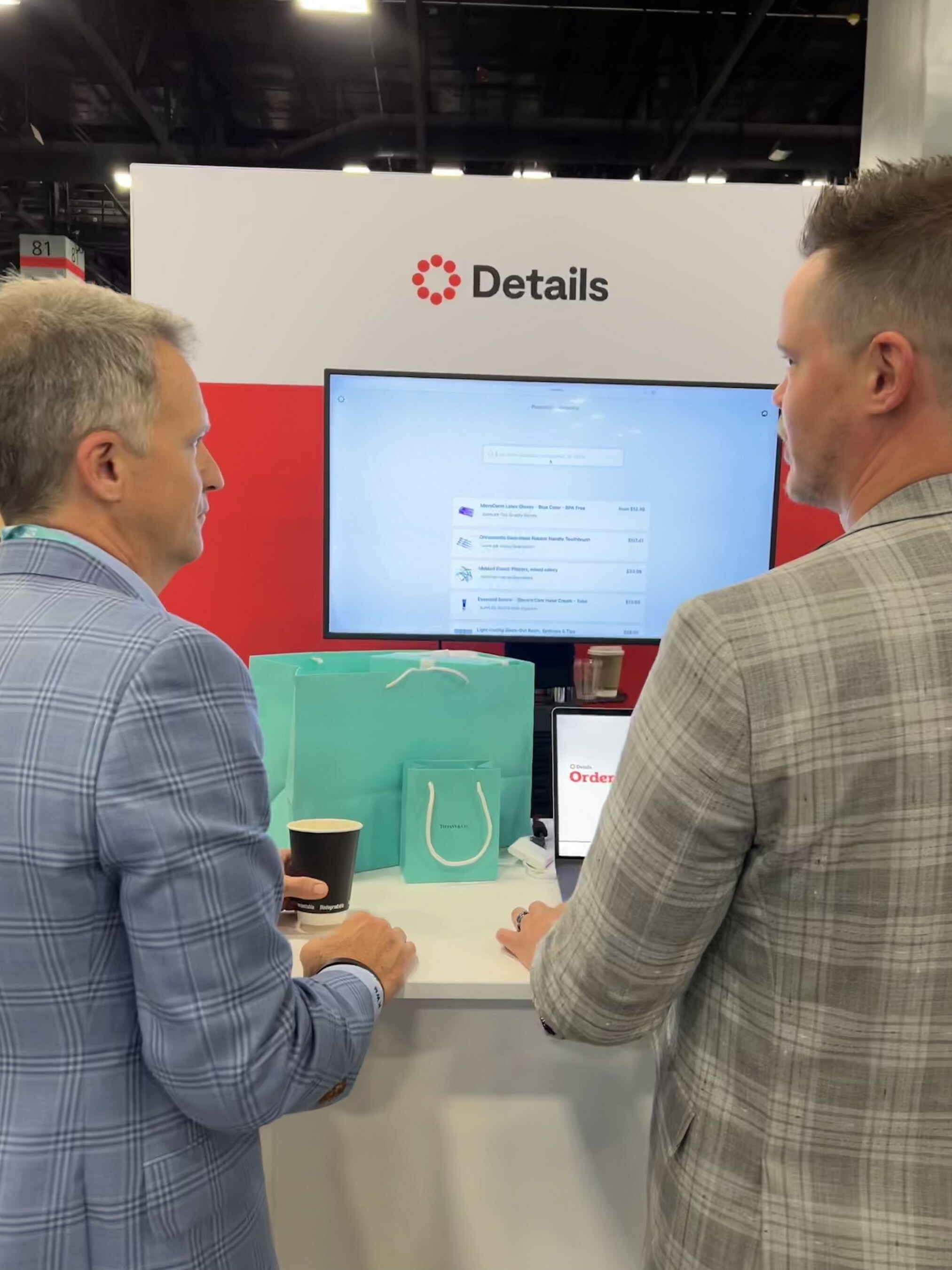 Details Director of Strategic Partnerships, Addison Wissel showing the Details ordering platform to orthodontic practice manager Kenneth Moss.